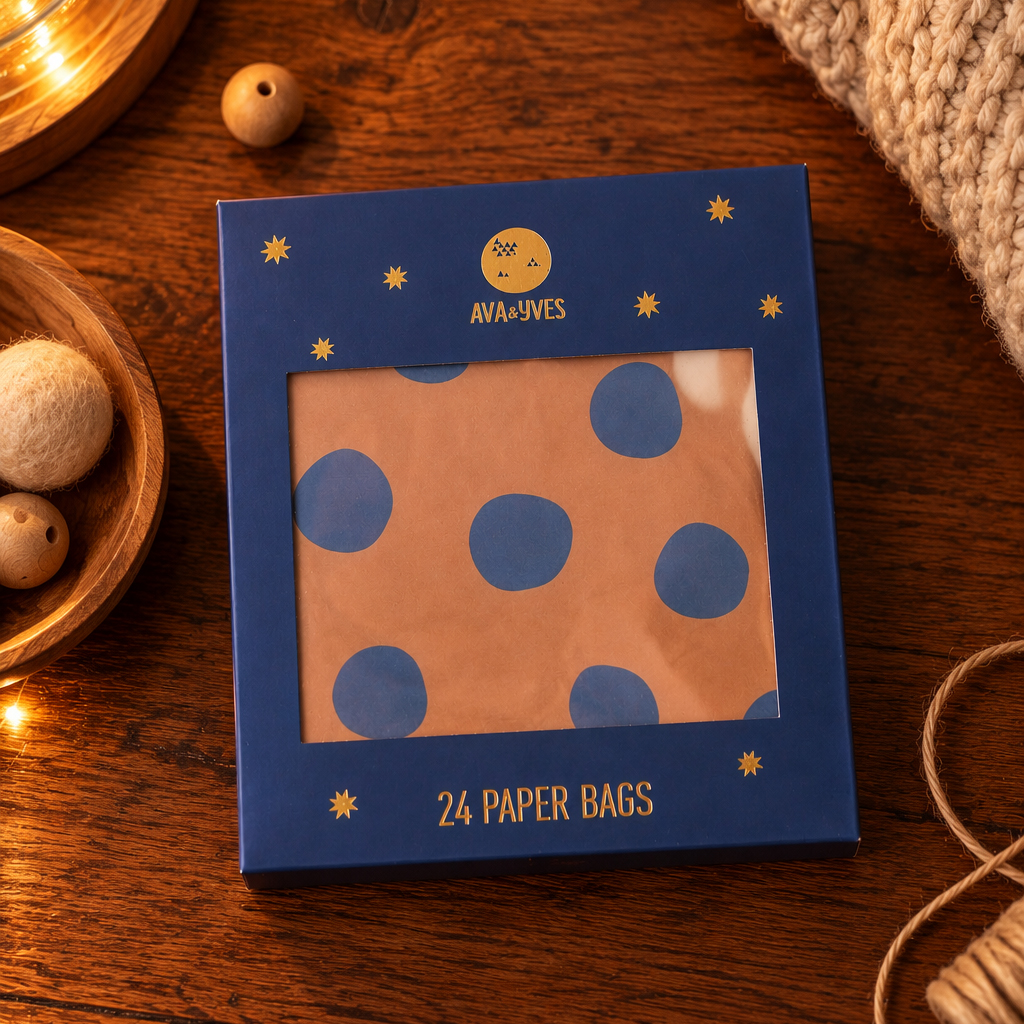 Blue Av a&Yves box with 24 paper bags featuring blue polka dots, shown on a wooden table.