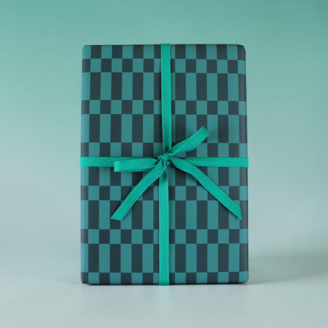 Gift box wrapped in teal-and-black checker paper with a teal ribbon tied in a bow.