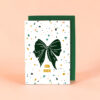 2379grusskarteb6schleifegruenhell Avayves Feine Papeterie Und Geschenke Für Babys Und Kids Greeting card with a dark green bow on a white terrazzo-patterned front that reads 'FÜR DICH' (For You).
